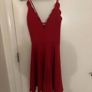 Red low V-neck; criss-cross back strap mini dress